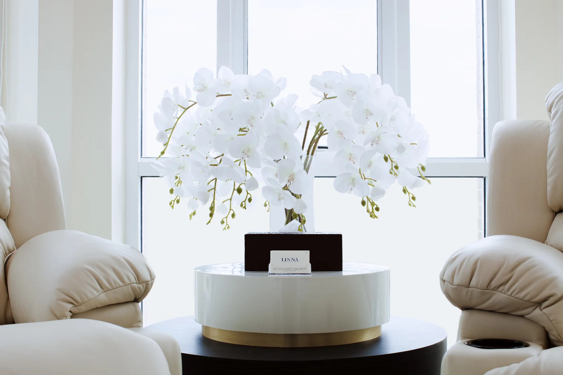 LINNA lounge with orchid centerpiece