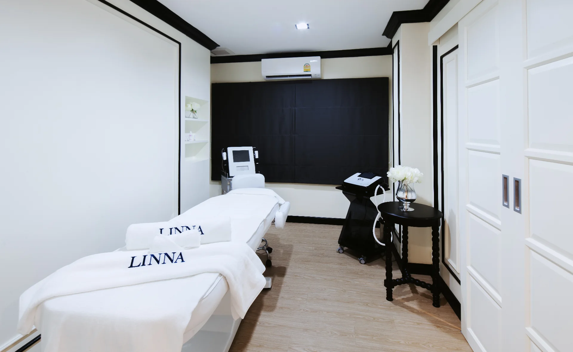 LINNA treatment room with branded linens